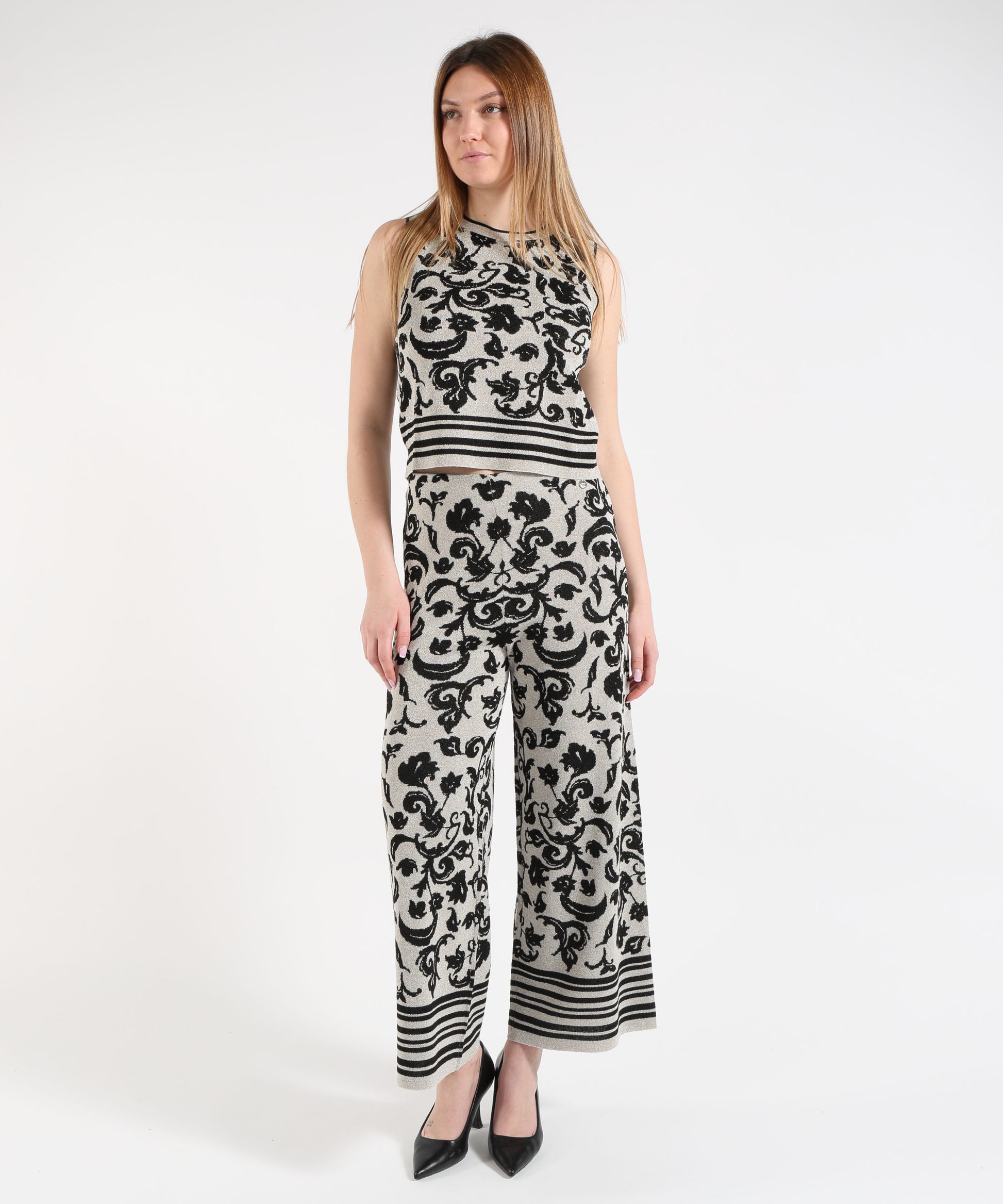 Pantaloni LIUJO WHITE Pantalone cropped in maglia con stampa floreale Argento/nero | LIUJO WHITE